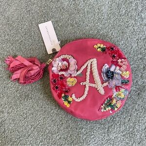 Beaded leather monogram zipper Pouch with tassel pull brand  new with tag